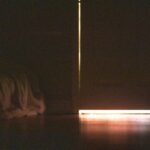 a person holding a light saber