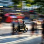 a blurry photo of a person riding a motorcycle
