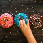 three sprinkled doughnuts