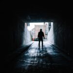 silhouette of man in underground garage