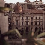 people walking near ancient historic buildings