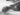 grayscale photo of person lying on bed