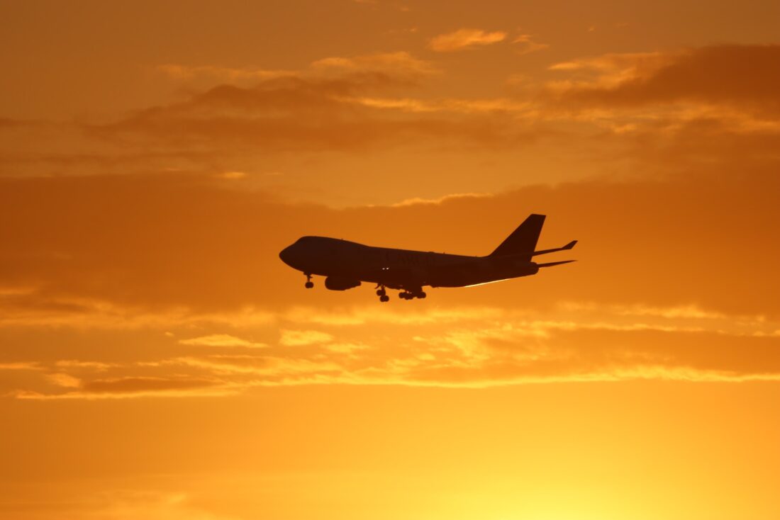 airplane under golden hour skies