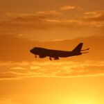 airplane under golden hour skies