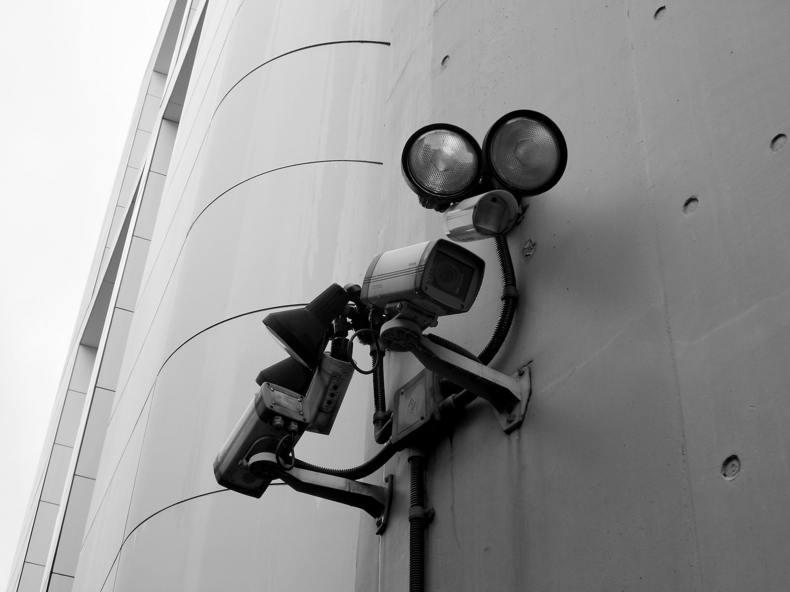a security camera attached to the side of a building